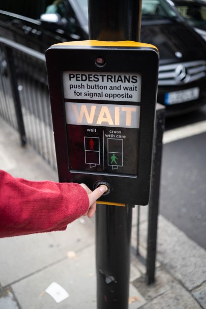 photo-of-person-pressing-the-button-of-pedestrian-box-1827232