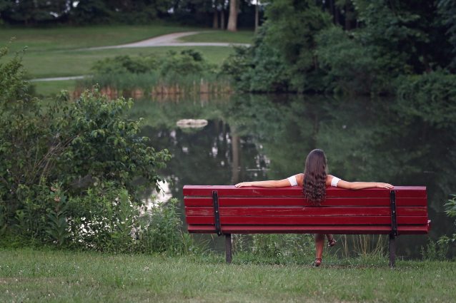 photography-of-woman-relaxing-on-bench-1205717